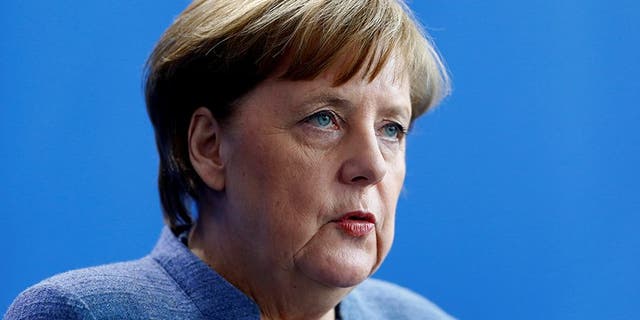 German Chancellor Angela Merkel addresses a news conference at the chancellery in Berlin, Germany, February 27, 2018. REUTERS/Hannibal Hanschke - RC12033B1980