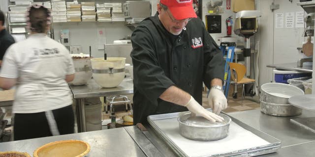 Bobby Jucker assembles a layer of the Pumpecapple.