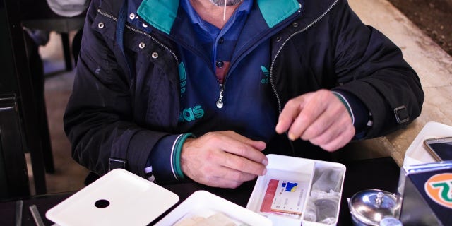 "Abu Mohammed" selling artifacts, which he claims to be from ancient Palmyra in Syria, on the black market in southern Turkey.