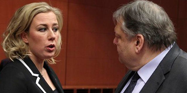 Feb. 9, 2012: Finnish Finance Minister Jutta Urpilainen, left, talks with Greek Finance Minister Evangelos Venizelos, at the European Council building in Brussels. There are fundamental doubts among some of the countries that use the euro over whether a second massive bailout for Greece will actually work, a European official said.