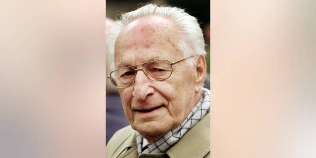 FILE - The April 18, 2002 file photo shows the last defense minister of the GDR Heinz Kessler as he attends the funeral of the wife of GDR founder Walter Ulbricht, Lotte Ulbricht in Berlin. Kessler who was convicted of manslaughter for upholding the shoot-to-kill order at the communist country’s border, has died. He was 97. (AP Photo/Herbert Knosowski, file)
