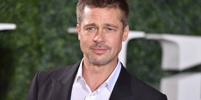 FILE - In this Nov. 9, 2016 file photo, Brad Pitt arrives at the Los Angeles premiere of "Allied." Pitt stars in the new film, “War Machine,” in which he plays a slightly fictionalized version of Gen. Stanley McChrystal. (Photo by Jordan Strauss/Invision/AP, File)