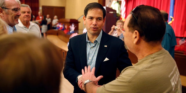 Republican presidential candidate Sen. Marco Rubio, R-Fla., shakes hands during a campaign event Saturday, July 11, 2015, in Henderson, Nev. (AP Photo/John Loche20