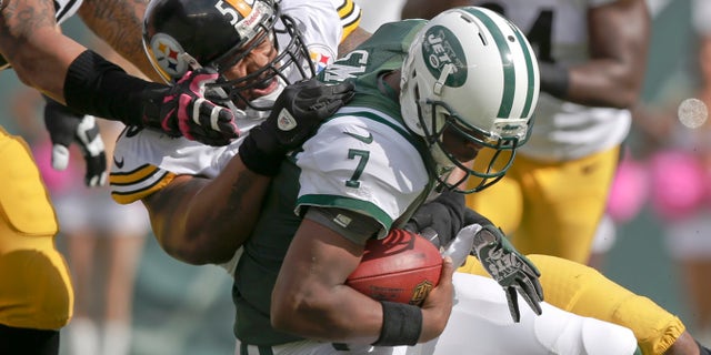 Pittsburgh Steelers outside linebacker LaMarr Woodley (56) sacks New York Jets quarterback Geno Smith (7) during the first half of an NFL football game Sunday, Oct. 13, 2013, in East Rutherford, N.J. (AP Photo/Kathy Willens)
