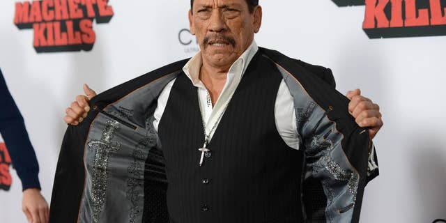 FILE - In this Oct. 2, 2013, file photo, actor Danny Trejo arrives at the premiere of "Machete Kills" at Regal Cinemas L.A. Live in Los Angeles. The Los Angeles Times reports Trejo took the floor at a community meeting at Sylmar High School in Los Angeles on May 11, 2016, following a brawl at the school. (Photo by Jordan Strauss/Invision/AP, File)