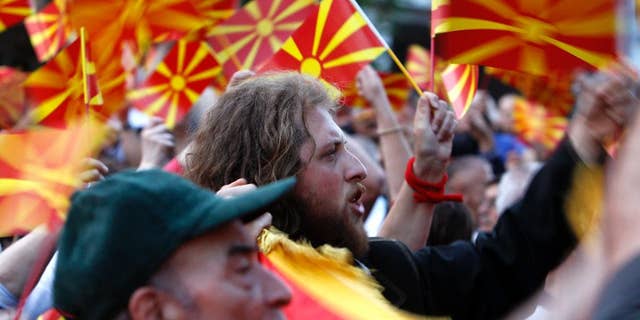 People wave Macedonian flags during a paceful protest in front of the EU mission building in Skopje, Macedonia, Friday, April 28, 2017.
About 2,000 protesters have gathered in Macedonia’s capital Skopje to demand new elections to try and break the country’s political deadlock, a day after violent protests inside the country’s parliament. (AP Photo/Boris Grdanoski)