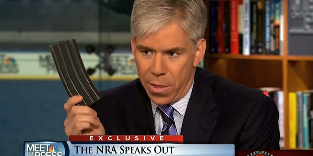 This image made from video provided by NBC's "Meet the Press" shows host David Gregory holding what he described as a high-capacity ammunition magazine during the taping of the Sunday, Dec. 23, 2012 program. He was interviewing National Rifle Association executive vice president Wayne LaPierre and used the magazine as a prop while discussing gun control. Gregory won't face charges for possession of a high-capacity magazine D.C. prosecutors announced Friday, Jan. 11, 2013 saying criminal charges wouldn't serve the public's best interests. (AP Photo/Meet the Press)