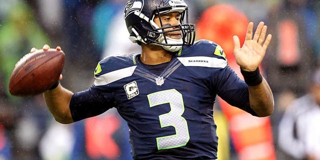 Nov 17, 2013; Seattle, WA, USA; Seattle Seahawks quarterback Russell Wilson (3) passes against the Minnesota Vikings during the second half at CenturyLink Field. Mandatory Credit: Joe Nicholson-USA TODAY Sports