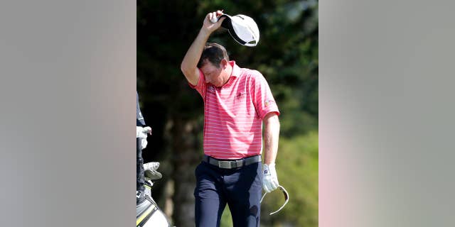 Jim Herman wipes his brow on the second tee during the first round of the Tournament of Champions golf event, Thursday, Jan. 5, 2017, at Kapalua Plantation Course in Kapalua, Hawaii. (AP Photo/Matt York)