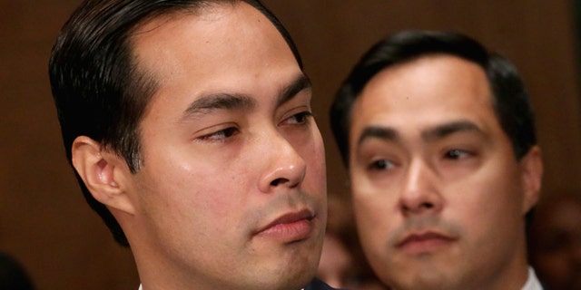 WASHINGTON, DC - JUNE 17: Mayor Julian Castro (L) testifies during his confirmation hearing before the Senate Banking, Housing and Urban Affairs Committee with his twin brother, Rep. Joaquin Castro (D-TX), in the background June 17, 2014 in Washington, DC. The current mayor of San Antonio, Texas, Castro has not faced serious opposition in the Senate. (Photo by Chip Somodevilla/Getty Images)