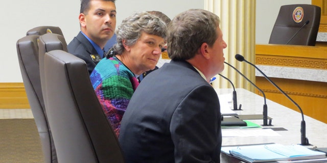 In this April 29, 2015 photo, state Sen. Leroy Garcia, left, one of the sponsors of a bill to change Colorados proxy marriage law to be limited to the military and government contractors, participates in a hearing at the state Capitol in Denver. Also pictured, middle, is Denver County Clerk Debra Johnson, an at right is El Paso County Clerk Chuck Broerman. The three testified in the Senate Judiciary Committee. (AP Photo/Kristen Wyatt)