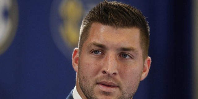 FILE - In this Dec. 5, 2014, file photo, Tim Tebow speaks during an SEC television broadcast in Atlanta. Tebow is expected to sign a one-year contract with the Philadelphia Eagles on Monday, April 20, 2015 according to three people familiar with the deal. (AP Photo/Brynn Anderson, File)
