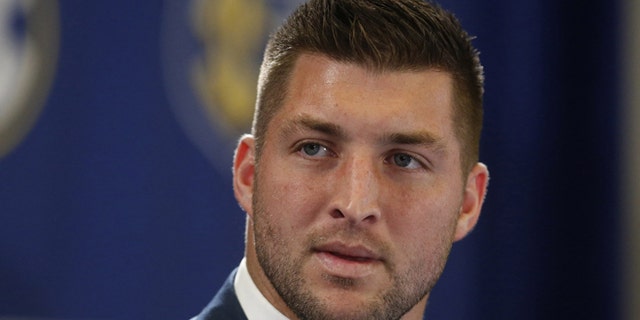 FILE - In this Dec. 5, 2014, file photo, Tim Tebow speaks during an SEC television broadcast in Atlanta. Tebow is expected to sign a one-year contract with the Philadelphia Eagles on Monday, April 20, 2015 according to three people familiar with the deal. (AP Photo/Brynn Anderson, File)