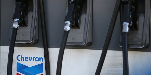 SAN FRANCISCO, CA - MAY 02: The Chevron logo is displayed on a gas pump at a Chevron gas station on May 2, 2014 in San Francisco, California. Chevron Corp. reported a 27 percent plunge in first quarter profits with earnings of $4.51 billion, or $2.36 a share, compare to $6.18 billion, or $3.18 a share, one year ago. (Photo by Justin Sullivan/Getty Images)