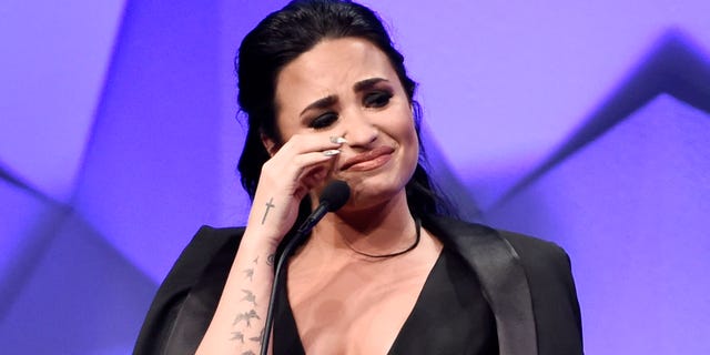 Singer Demi Lovato becomes emotional as she accepts the Vanguard Award during the 27th Annual GLAAD Media Awards at the Beverly Hilton on Saturday, April 2, 2016, in Beverly Hills, Calif. (Photo by Chris Pizzello/Invision/AP)