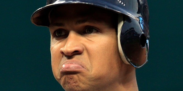 FILE - In this July 28, 2010 file photo, New York Yankees' Alex Rodriguez reacts after he popped out in the second inning in a baseball game against the Cleveland Indians in Cleveland. Injuries have kept him off the field for more than half the season and now A-Rod faces discipline from Major League Baseball in its drug investigation, possibly up to a lifetime ban.  (AP Photo/Tony Dejak File)