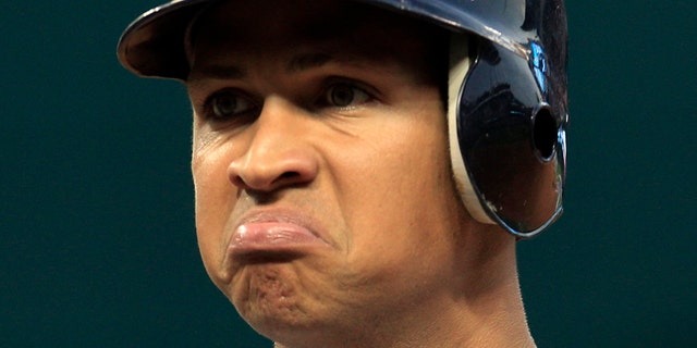 FILE - In this July 28, 2010 file photo, New York Yankees' Alex Rodriguez reacts after he popped out in the second inning in a baseball game against the Cleveland Indians in Cleveland. Injuries have kept him off the field for more than half the season and now A-Rod faces discipline from Major League Baseball in its drug investigation, possibly up to a lifetime ban. (AP Photo/Tony Dejak File)