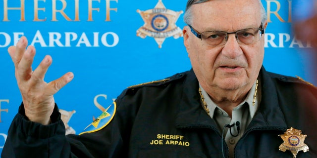 FILE - In this Dec. 18, 2013 file photo, Maricopa County Sheriff Joe Arpaio announces dozens of arrests in a prostitution sting during a news conference at Maricopa County Sheriff's Office Headquarters in Phoenix. Arpaio, who has often clashed with the federal government over the enforcement of immigration laws has filed a lawsuit to stop new policies announced by President Barack Obama. The suit filed Thursday, Nov. 20, 2014 in federal court in Washington on behalf of Maricopa County Sheriff Joe Arpaio contends Obama acted outside his constitutional authority by not going through Congress. (AP Photo/Ross D. Franklin)