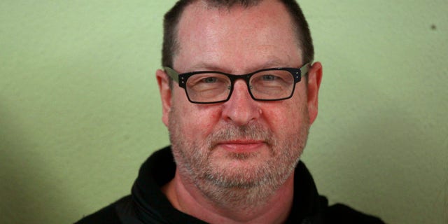 Director Lars Von Trier poses on the film set of 'Nymphomaniac' at a former primary school in Cologne September 20, 2012. The film will chronicle the sexual adventures of a woman played by actress Charlotte Gainsbourg from her youth through age 50 with actor Stellan Skarsgard playing her husband. REUTERS/Ina Fassbender (GERMANY - Tags: ENTERTAINMENT HEADSHOT) - RTR3872U