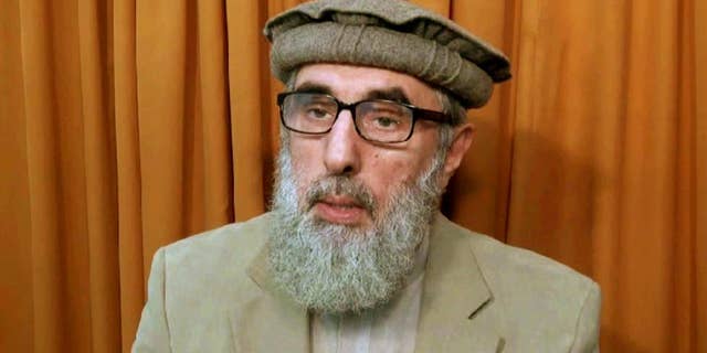 FILE - This file image made from video released to the Associated Press during the week of Nov. 21, 2015 shows Afghan warlord Gulbuddin Hekmatyar, now in his late 60s, in an undisclosed location. The United Nations removed the name of the former Afghan warlord from its Islamic State group and al-Qaida sanctions list. According to a statement posted Friday, Feb. 3, 2017, by the Security Council, a U.N. committee removed Gulbuddin Hekmatyar's name from the sanctions list. (AP photo via AP video, File)