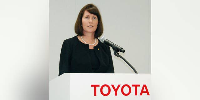 Julie Hamp, Toyota Motor Corp.'s new head of public relations, speaks during a press conference in Toyota, central Japan, Wednesday, June 17, 2015. Hamp was arrested Thursday, June 18, on suspicion of importing an illegal pain medicine into Japan, Tokyo police said. Hamp, an American, was appointed in April as Toyota's first female top executive. She had been moving her things to Japan from California, where she had been head of communications for Toyota's U.S. operations. (Kyodo News via AP) JAPAN OUT, CREDIT MANDATORY