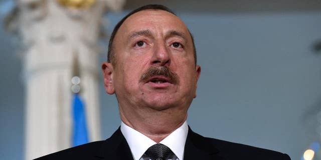 FILE - In this March 30, 2016 file photo, Azerbaijani President Ilham Aliyev makes a statement before a meeting with U.S. Secretary of State John Kerry at the State Department in Washington. A European law and human rights commission, in a report released on Wednesday, Sept. 21, 2016, has criticized proposed constitutional changes in Azerbaijan that would extend the president’s term. (AP Photo/Susan Walsh, File)