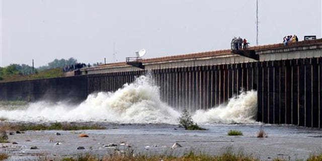 May 14: Water diverted from the Mississippi River spills through a bay in the Morganza Spillway in Morganza, La. A steel, 10-ton floodgate was slowly raised Saturday for the first time in nearly four decades, unleashing a torrent of water from the Mississippi River, away from heavily populated areas downstream. (AP)