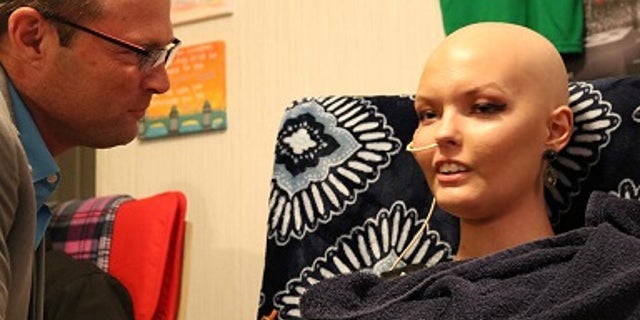 Brett (left) said his daughter's faith has helped the family through her cancer diagnosis.