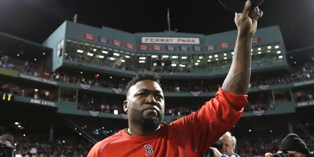 FILE- In this Oct. 10, 2016, file photo, Boston Red Sox designated hitter David Ortiz tips his cap after Game 3 of baseball's American League Division Series against the Cleveland Indians in Boston. Ortiz is set to speak at the New England Institute of Technology's 76th commencement at the Dunkin Donuts Center in Providence on Sunday, April 30, 2017. (AP Photo/Charles Krupa, File)