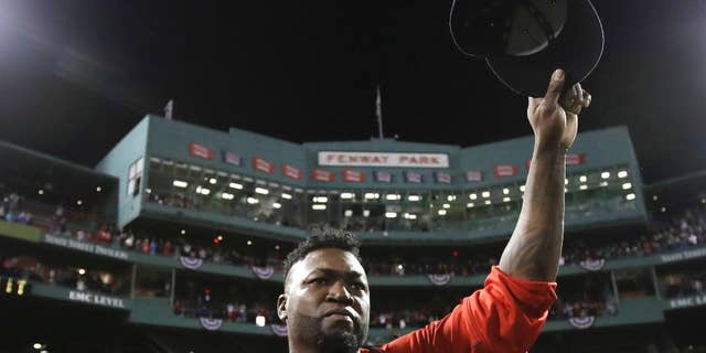 FILE- In this Oct. 10, 2016, file photo, Boston Red Sox designated hitter David Ortiz tips his cap after Game 3 of baseball's American League Division Series against the Cleveland Indians in Boston. Ortiz is set to speak at the New England Institute of Technology's 76th commencement at the Dunkin Donuts Center in Providence on Sunday, April 30, 2017. (AP Photo/Charles Krupa, File)