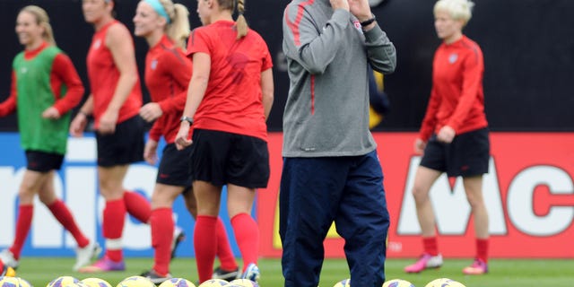 U.S. women's soccer team coach Tom Sermanni yells directions during practice in Jacksonville, Fla., on Friday, Feb. 8, 2013. (AP Photo/The Florida Times-Union, Bob Mack)