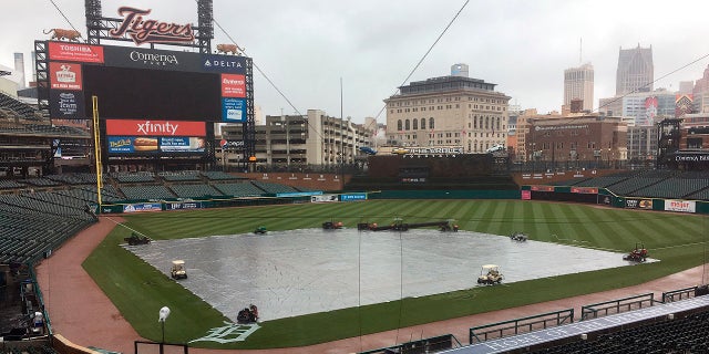 The field is covered as the Yankees and Tigers were rained out at Comerica Park in Detroit, April 14, 2018.
