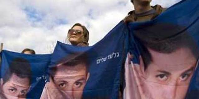 Feb. 18: Israeli demonstrators hold banners showing captured Israeli soldier Sgt. Gilad Schalit during a rally calling for his release in Jerusalem.