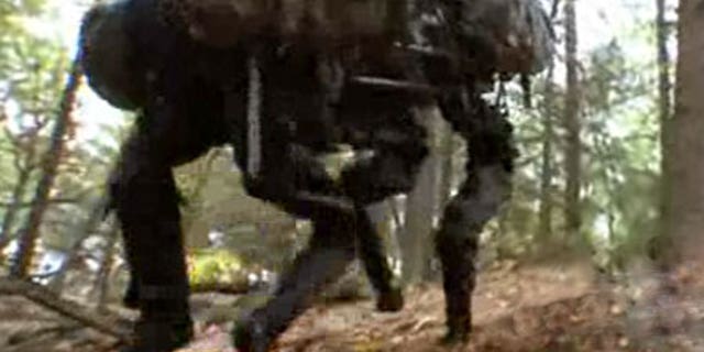 A BigDog robot climbs a hill in a test of its versatility. The U.S. military is deploying the robots to Afghanistan to navigate the country's treacherous terrain.