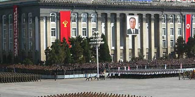 File: North Korean soldiers parade in front of Workers' Party of Korea headquarters building in Pyongyang.