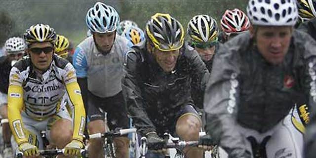 Lance Armstrong, center, in the pack during the 13th Stage of the Tour de France.