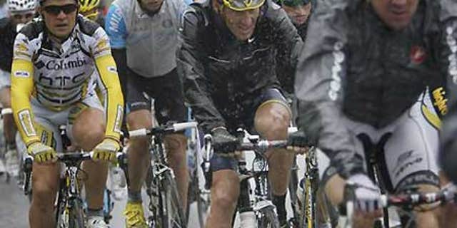 Lance Armstrong, center, in the pack during the 13th Stage of the Tour de France.