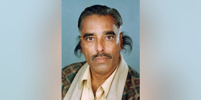 In this undated handout photograph provided by the Guinness World Records book, record holder Radhakant Bajpai is seen with his long ear hair.
