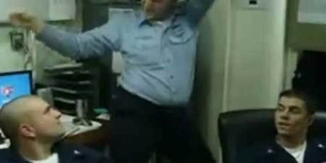 An unidentified Navy sailor, flanked by two others, dances in a YouTube video filmed by murder-suicide victim Michael Joseph Missimer.