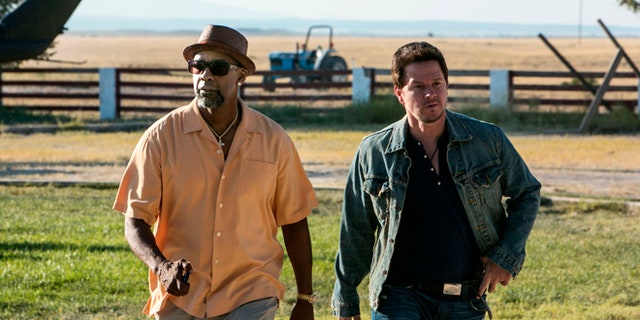 This image released by Universal Pictures shows Denzel Washington, left, and Mark Wahlberg in a scene from "2 Guns."