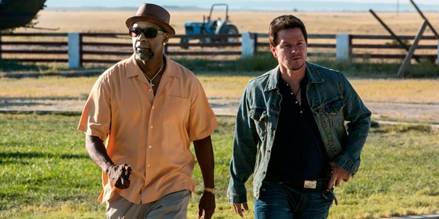 This image released by Universal Pictures shows Denzel Washington, left, and Mark Wahlberg in a scene from "2 Guns."