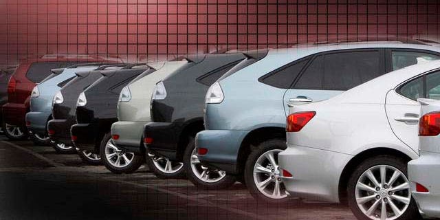 New cars are seen lined up at a dealership in Peabody, Mass. Monday, Jan. 5, 2009. Huge rebates and zero-percent loans couldn't trump economic uncertainty and the specter of bankruptcy as U.S. auto sales plunged 35 percent in December, capping a dismal 2008 that saw sales free-fall by more than 3 million vehicles from 2007. (AP Photo/Winslow Townson)