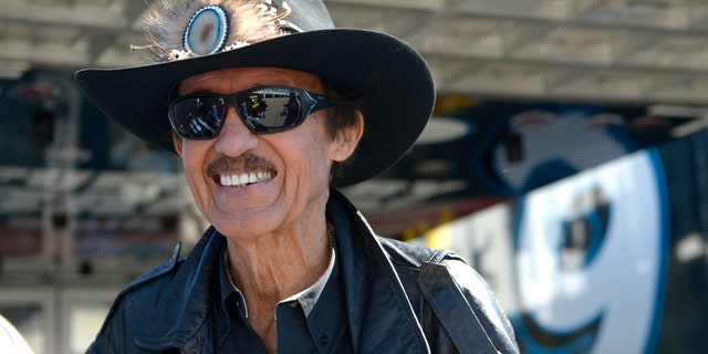 Car owner and and even-time NASCAR champion Richard Petty stands outside his hauler in the garage area during qualifying for the NASCAR Daytona 500 auto race at Daytona International Speedway in Daytona Beach, Fla., Sunday, Feb. 16, 2014. (AP Photo/Phelan M. Ebenhack)
