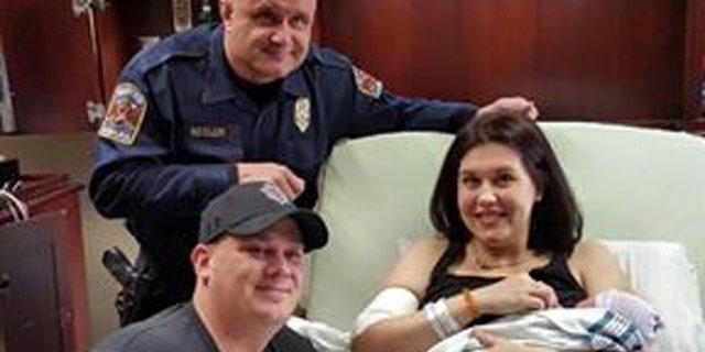 Trooper Michael Kesler with the new parents.