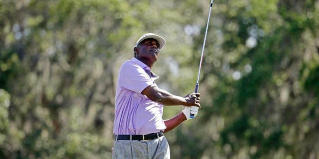 Vijay Singh, of Fiji, watches his shot from the 12th tee during the second round of The Players Championship golf tournament Friday, May 12, 2017, in Ponte Vedra Beach, Fla. (AP Photo/Lynne Sladky)