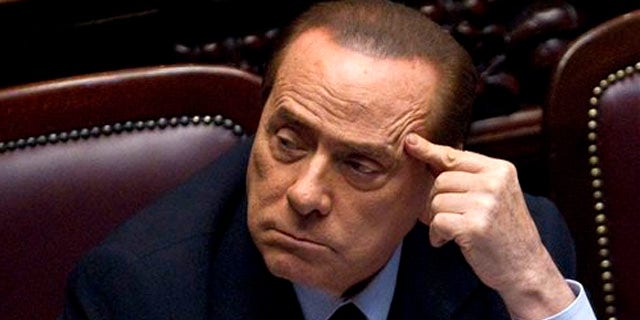 Italian Premier Silvio Berlusconi votes over a crucial austerity package.