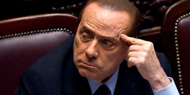 Italian Premier Silvio Berlusconi votes over a crucial austerity package.