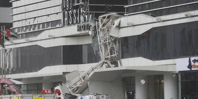A construction crane has collapsed during high winds on the main highway running through Dubai, disrupting traffic in the heart of the Mideast's commercial hub in Dubai, United Arab Emirates, Friday, Feb. 3, 2017. (AP Photo/Kamran Jebreili)
