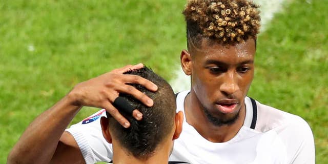 France's Kingsley Coman is replaced by Dimitri Payet during the Euro 2016 Group A soccer match between Switzerland and France at the Pierre Mauroy stadium in Villeneuve d’Ascq, near Lille, France, Sunday, June 19, 2016. (AP Photo/Thibault Camus)
