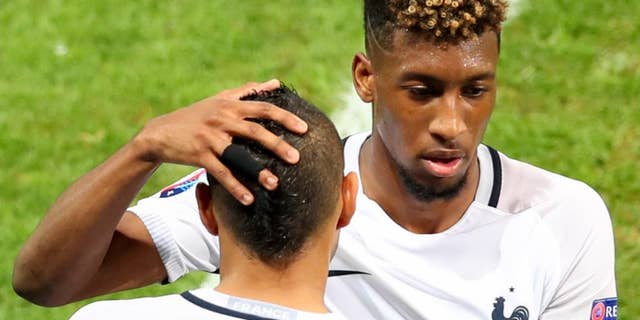 France's Kingsley Coman is replaced by Dimitri Payet during the Euro 2016 Group A soccer match between Switzerland and France at the Pierre Mauroy stadium in Villeneuve d’Ascq, near Lille, France, Sunday, June 19, 2016. (AP Photo/Thibault Camus)